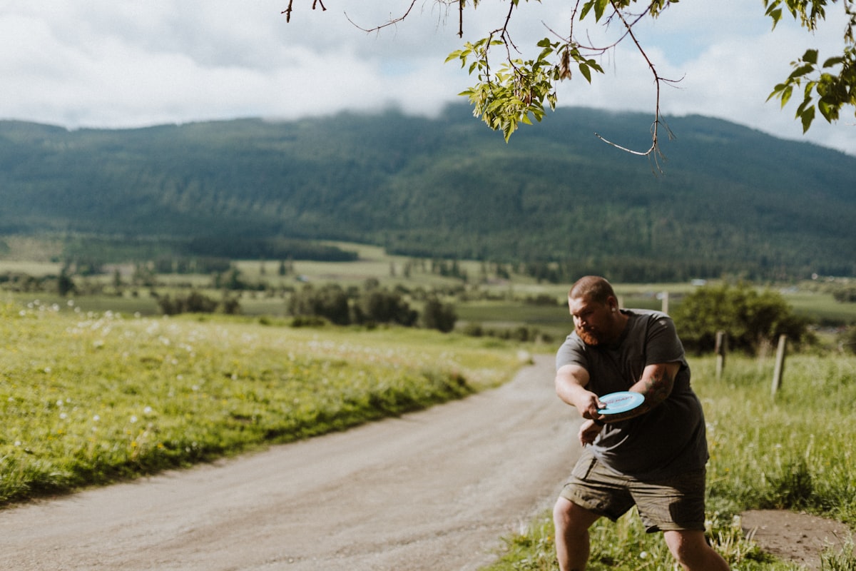 Fitness coach working with mature man